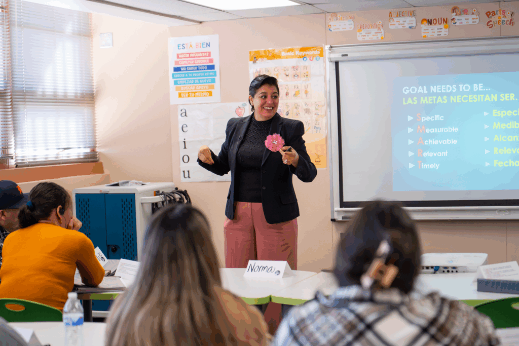 Norma Huerta addressing a group of participants in an Arizona family literacy program