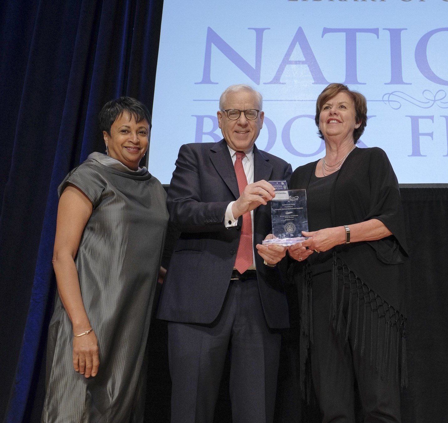 Librarian of Congress Carla Hayden and Literacy Awards benefactor David Rubenstein award the 2017 American Prize to the National Center for Families Learning from Louisville, Kentucky, during the National Book Festival Gala, September 1, 2017. Photo by Shawn Miller.