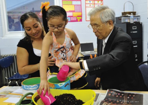 During his visit to Louisville, Kentucky in 2011, Dr. Toyoda and a family participating in family literacy engaged in a learning exercise together. Dr. Toyoda greatly enjoyed meeting the families who benefited from Toyota's contributions.
